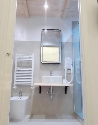 a bathroom with a sink and a mirror at Soste Normanne in Palermo