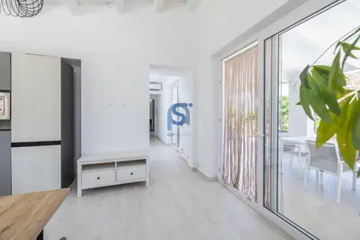 an office with a hallway with white walls and large windows at Villa Irene Deluxe in Campofelice di Roccella