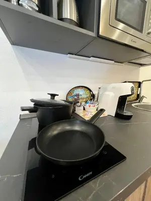 a frying pan on a stove in a kitchen at Kensia house - centro storico - stazione in Palermo