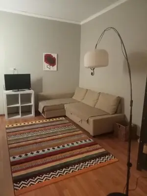 a living room with a couch and a lamp at Il balcone sulla Kalsa in Palermo