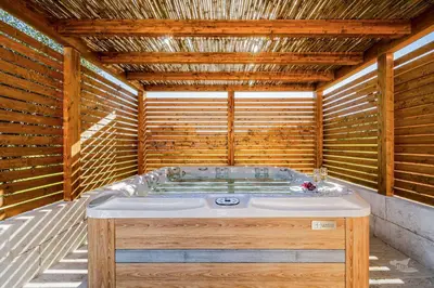 a jacuzzi tub in a wooden building at Villa DelMarmo in Alcamo