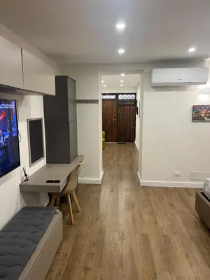 a room with a desk and a computer in it at Lolli House in Palermo
