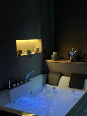 a black tray with two bottles of moisturizers on a bathroom counter at L'Opera - Luxury Apartment in Palermo