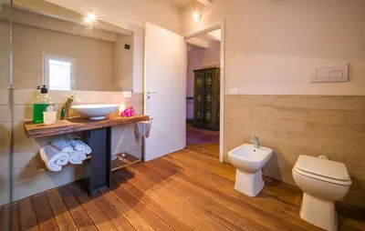 a bathroom with a sink and a toilet at Oasi Relax - Romantic Room & Spa in Torretta