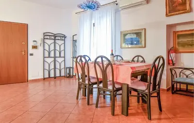 a dining room with a table and chairs at Gorgeous Apartment In Palermo With Wifi in Palermo