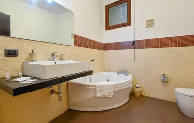 a bathroom with a tub and a sink and a toilet at Gorgeous Apartment In Palermo With Wifi in Palermo