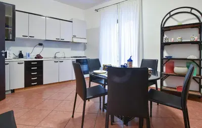 a kitchen and dining room with a table and chairs at Gorgeous Apartment In Palermo With Wifi in Palermo