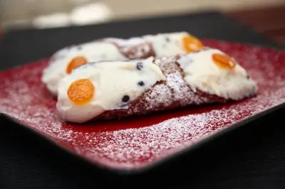 two pieces of food on a red plate at B&B Massimo Inn in Palermo