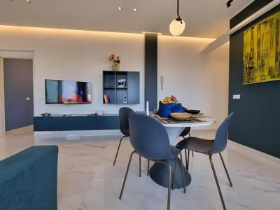 a dining room with a table and chairs at MaXelA Penthouse by Holiday World in Palermo