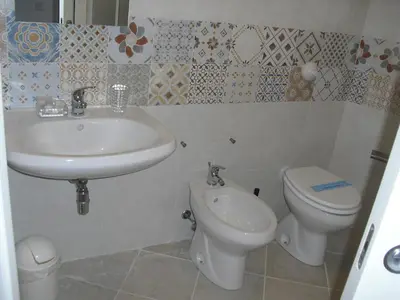 a bathroom with a sink and a toilet at Affittacamere Amunì in Castellammare del Golfo