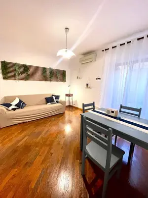 a living room with a couch and a table at Vicolo 20 in Palermo