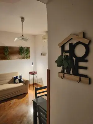a living room with a couch and a table at Vicolo 20 in Palermo