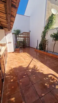 a large room with a stone floor in a house at Casa Corte Fiorita in San Vito lo Capo