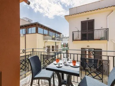 a patio with a table and chairs on a balcony at Apartment A Lapa by Interhome in Balestrate