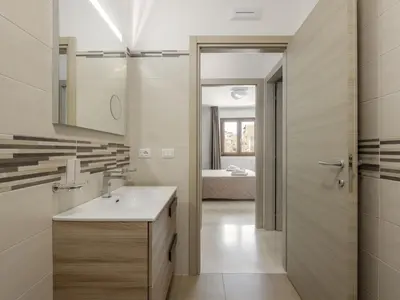 a bathroom with a sink and a mirror at Apartment A Lapa by Interhome in Balestrate