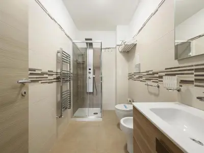 a bathroom with a shower and a toilet and a sink at Apartment A Lapa by Interhome in Balestrate
