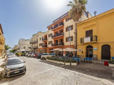 a street with cars parked next to a building at Apartment A Lapa by Interhome in Balestrate