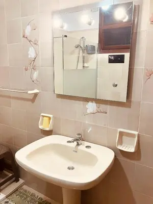 a bathroom with a sink and a mirror at Casa Praiola in Terrasini