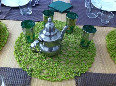 a table with a tea pot on top of a table at B&B Giulio Cesare 24 in Palermo