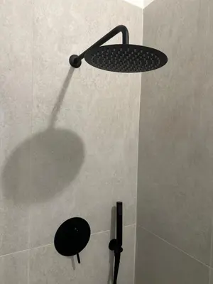 a shower with a shower head in a bathroom at La Dimora Del Centro in Palermo