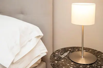 a bedroom with a large white bed with pillows at Le Sicilien - Moncada de Luna Exclusive Stay in Palermo