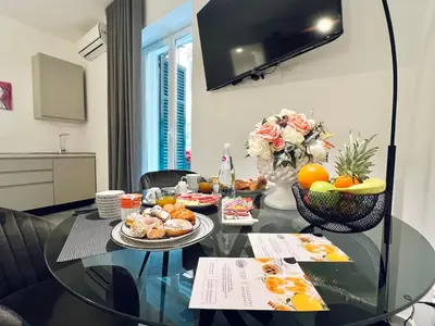a glass table with food on it in a living room at Pretoria Suites in Palermo