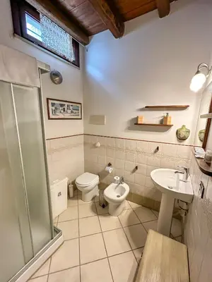 a bathroom with a toilet and a sink at Loft in Kalsa - By Rental BeB - in Palermo