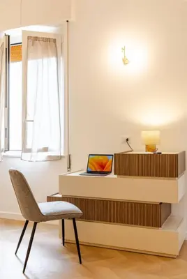 a room with a desk with a chair and a laptop at Residenza Camillo - Palermo Centro in Palermo