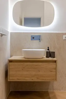 a bathroom with a sink and a mirror at Residenza Camillo - Palermo Centro in Palermo