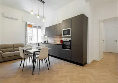a kitchen with a table and chairs in a room at Residenza Camillo - Palermo Centro in Palermo