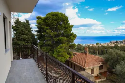 a balcony of a house with a view of the ocean at Trabia Villa Bedda Mia A in Trabia