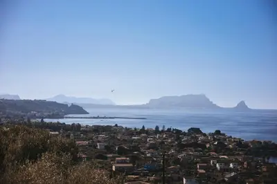 a city and the ocean with mountains in the background at Trabia Villa Bedda Mia A in Trabia