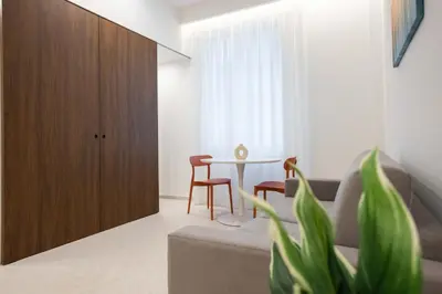 a living room with a couch and a table at Nora's Suites in Palermo