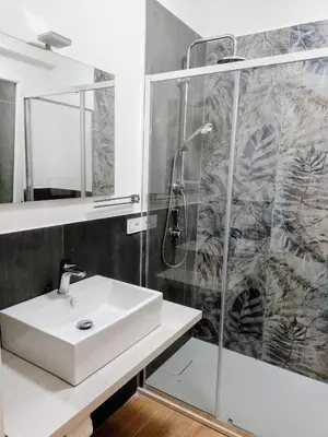 a bathroom with a sink and a shower at Holiday home 8 guests Granatelli in Altavilla Milicia