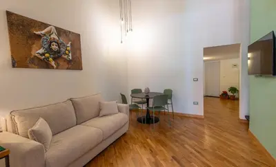 a living room with a couch and a table at Maison Castro Casetta a Palermo in Palermo