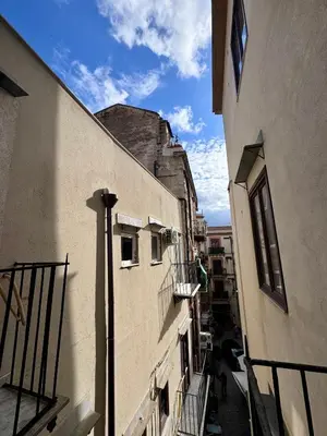 a view of an alley between two buildings at Tra i Vicoli del Capo in Palermo