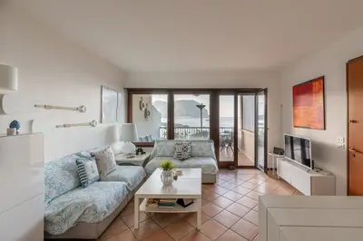a living room with a couch and a table at Casa Azzurra vista mare all'Addaura by Wonderful Italy in Palermo