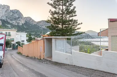 a christmas tree sitting on top of a fence at Casa Azzurra vista mare all'Addaura by Wonderful Italy in Palermo