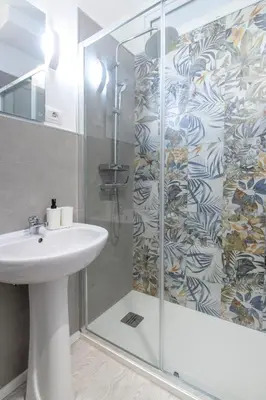 a bathroom with a sink and a shower at I tre Mori in Monreale