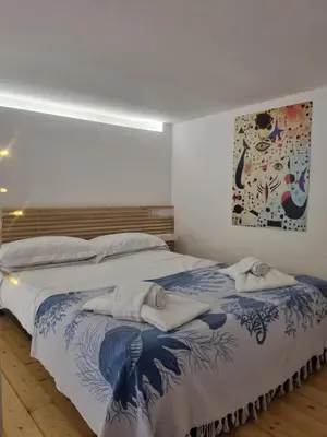 a bedroom with a large bed with towels on it at Casa Mondello Sea Life in Palermo