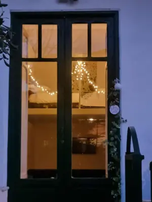 a window with christmas lights in a house at Casa Mondello Sea Life in Palermo