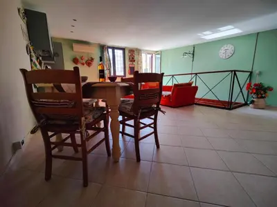 a dining room with a table and two chairs at La Muciara - Best Hospitality in Palermo