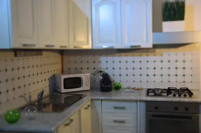 a kitchen with a microwave and a counter top at Appartamento XII Gennaio 3 in Palermo