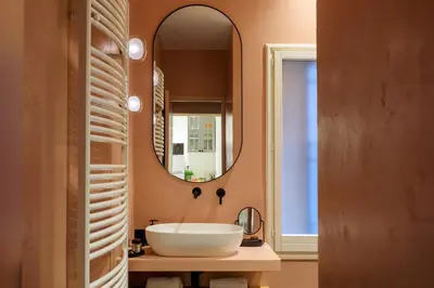 a bathroom with a white sink and a mirror at Palermo al Massimo in Palermo