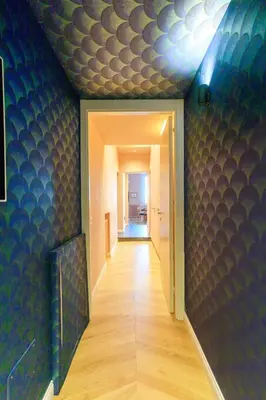 a hallway with a room with a blue wall at Palermo al Massimo in Palermo