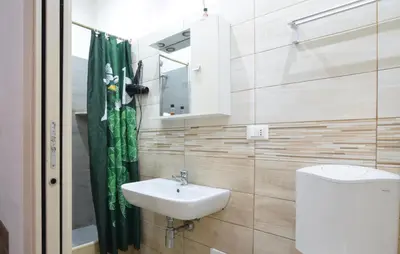 a bathroom with a sink and a toilet at Stunning Apartment In Palermo With Wifi in Palermo