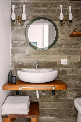 a bathroom with a sink and a mirror at Blu House in Terrasini