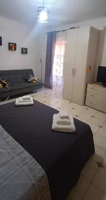 a bedroom with a bed with two towels on it at Casa Sarina in Monreale