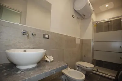 a bathroom with a sink and a toilet at Belle Arti in Palermo