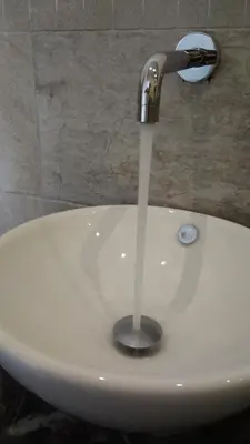 a stream of water coming out of a sink at Belle Arti in Palermo